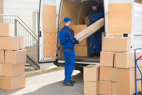 Man with van moving boxes for a local Harlington move