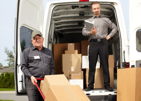 A professional house removals team preparing belongings for a move in Harlington