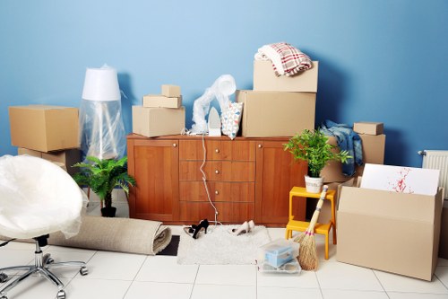 Removal team planning a house move in Harlington with boxes and furniture