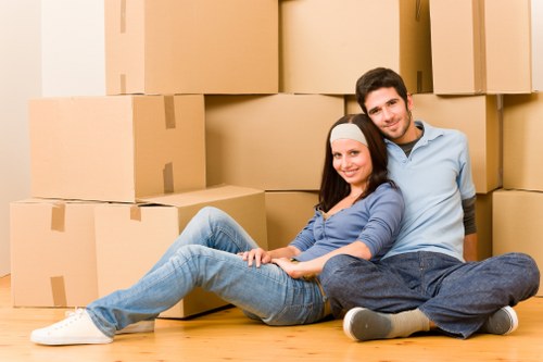 Harlington man with van loading furniture carefully