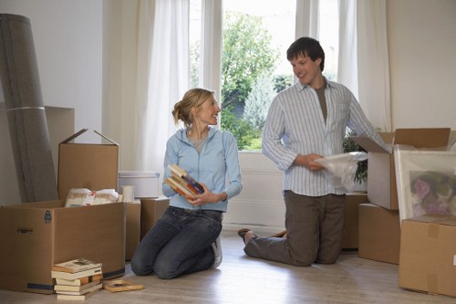 Removal crew loading boxes and furniture for a Harlington move