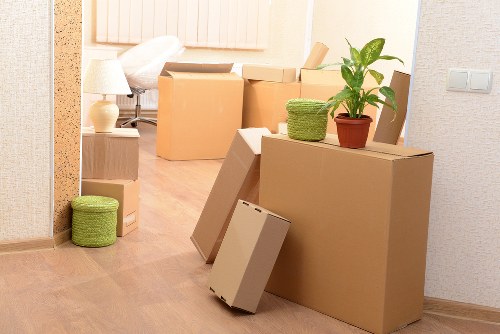 Local removals crew handling furniture near Harlington properties