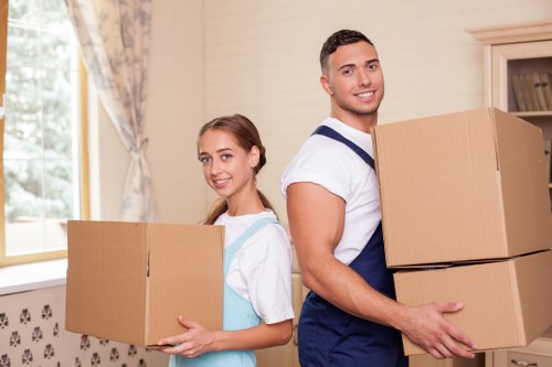 Packed boxes and furniture ready for transport by a Harlington removals company